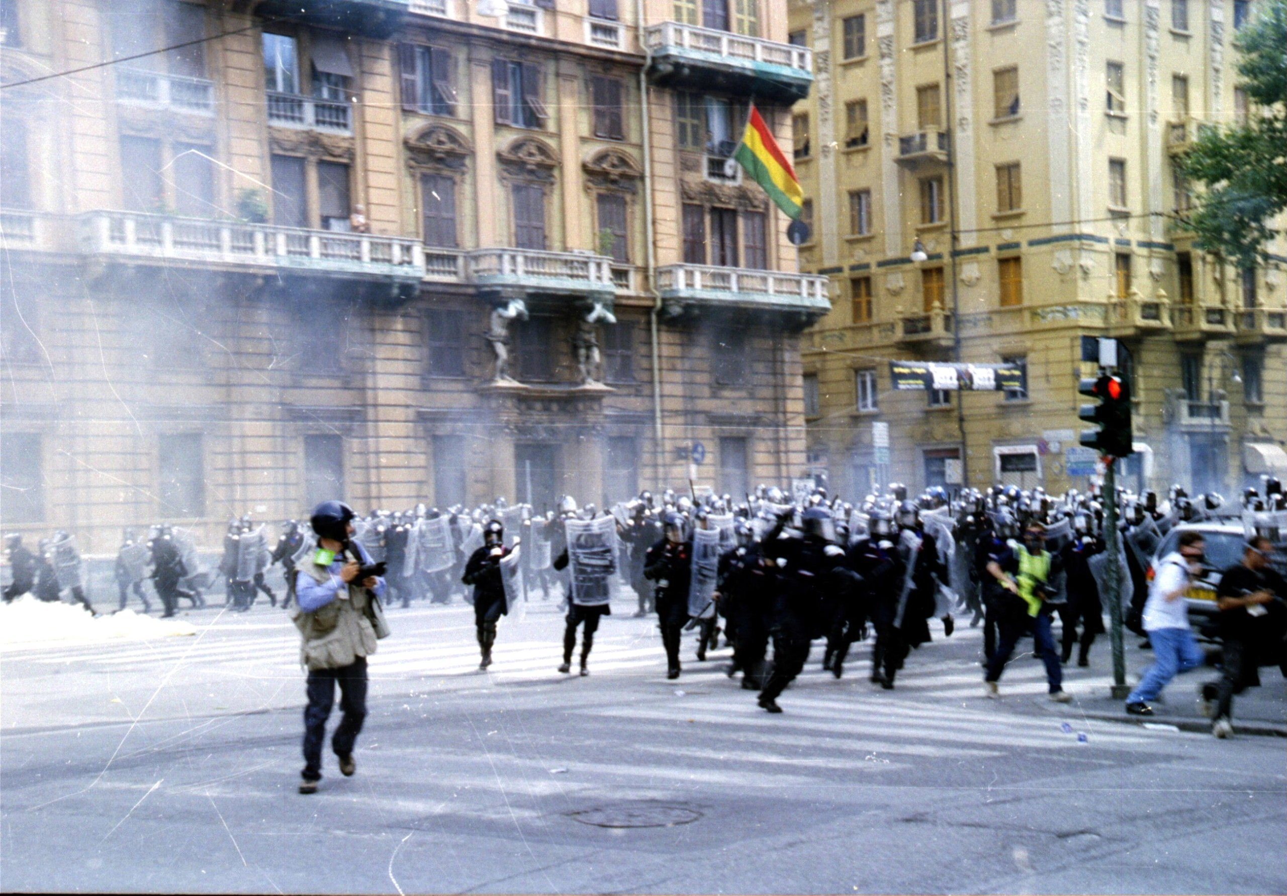 Police violently attack protesters outside the G8 summit in Genoa, Italy in July 2001