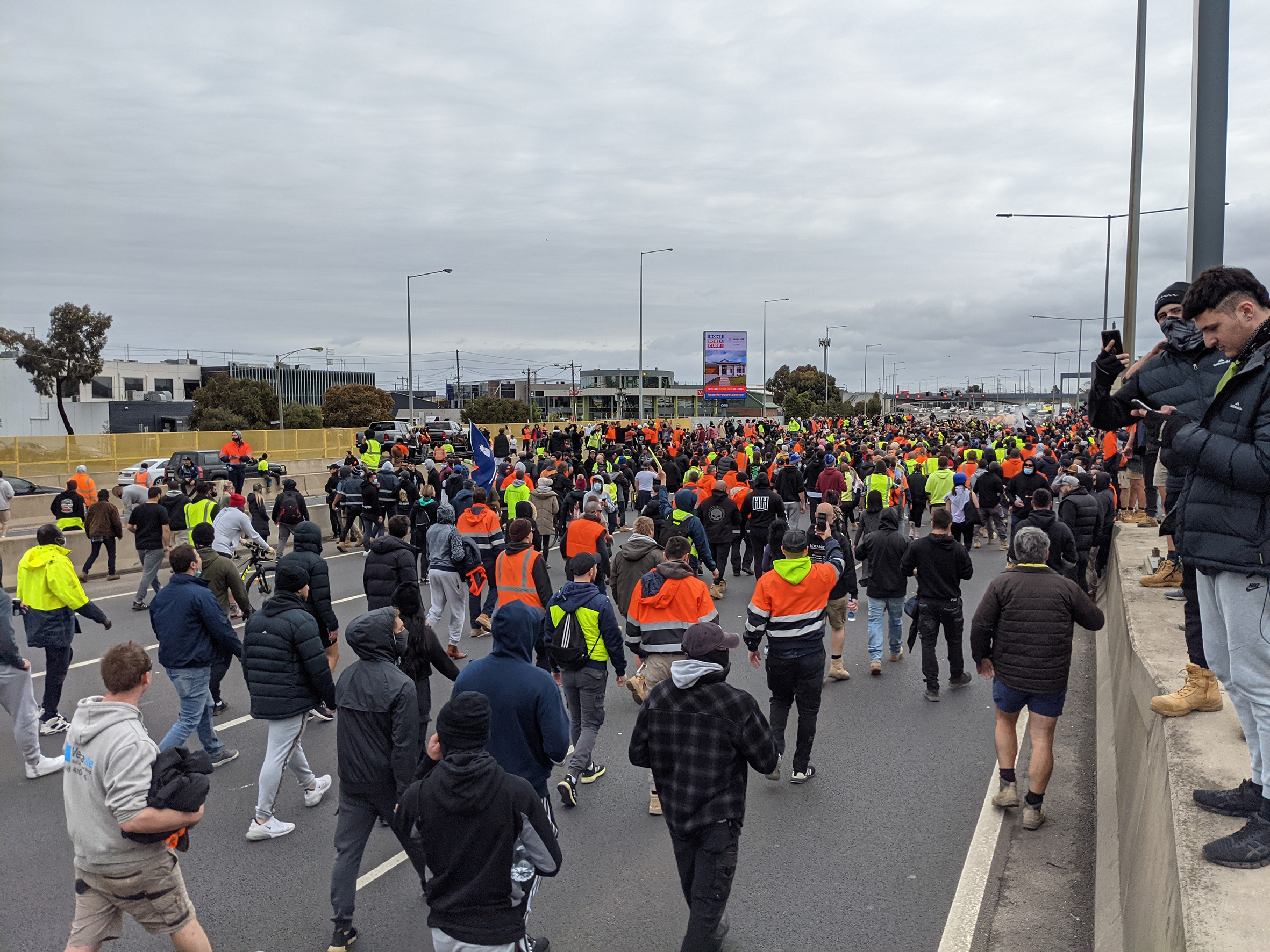 Protesters march along the Westgate Freeway